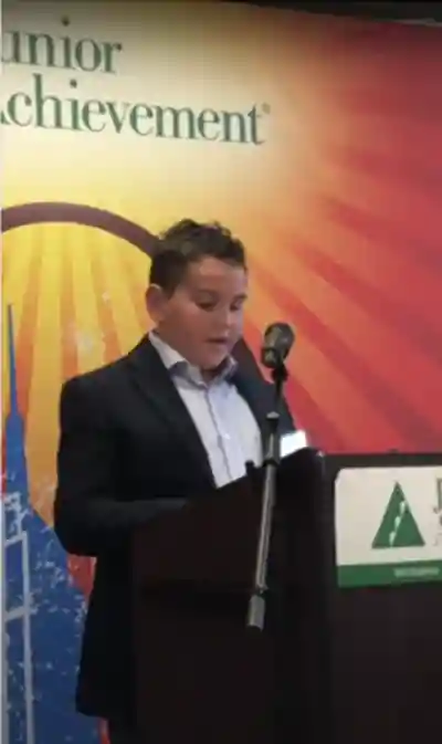 Young man behind lectern
